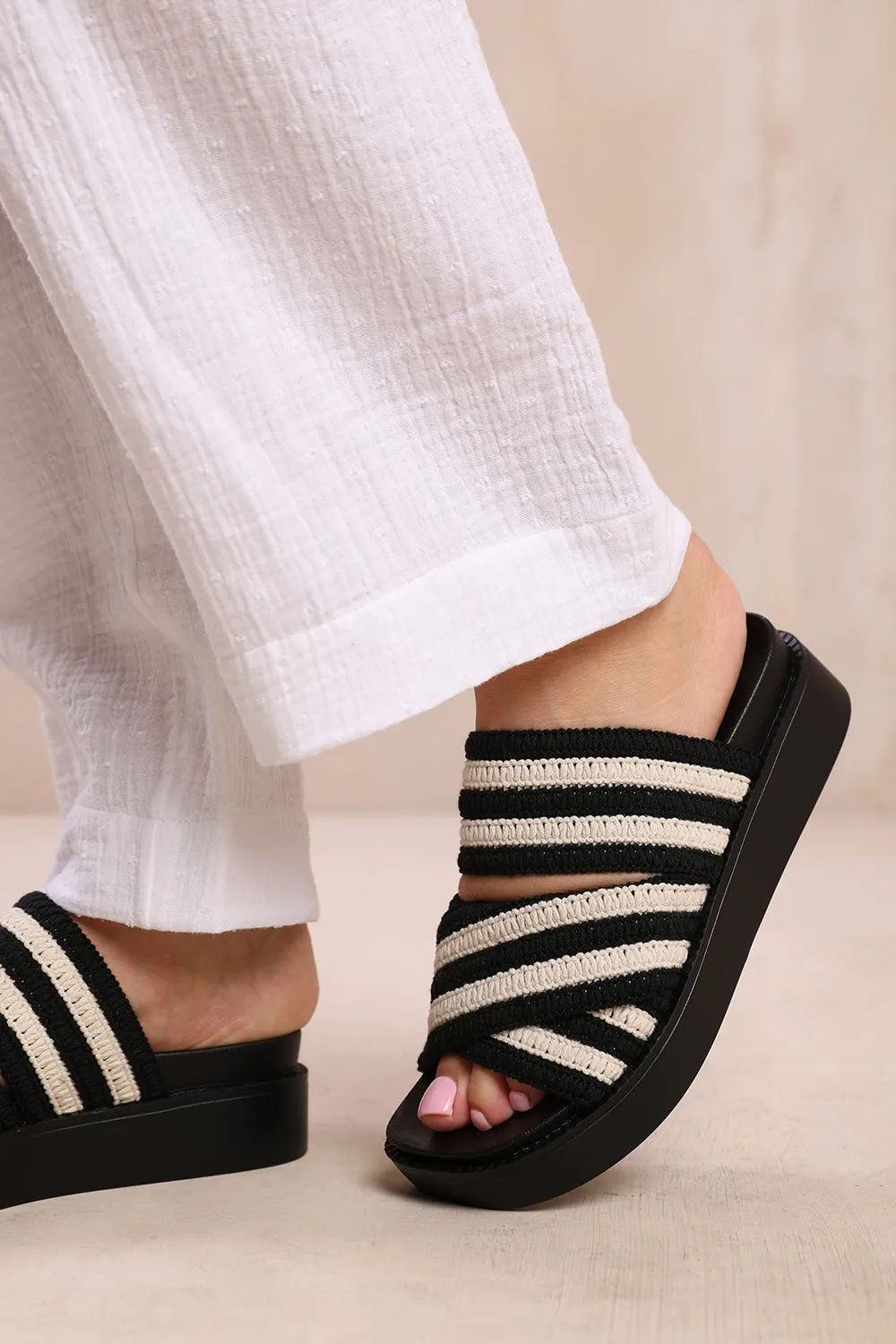 CROATIA FLATFORM STRIPED CROSS OVER CROCHET STRAP SANDALS IN BLACK